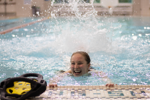 Smiling student in the water at the Natatorium