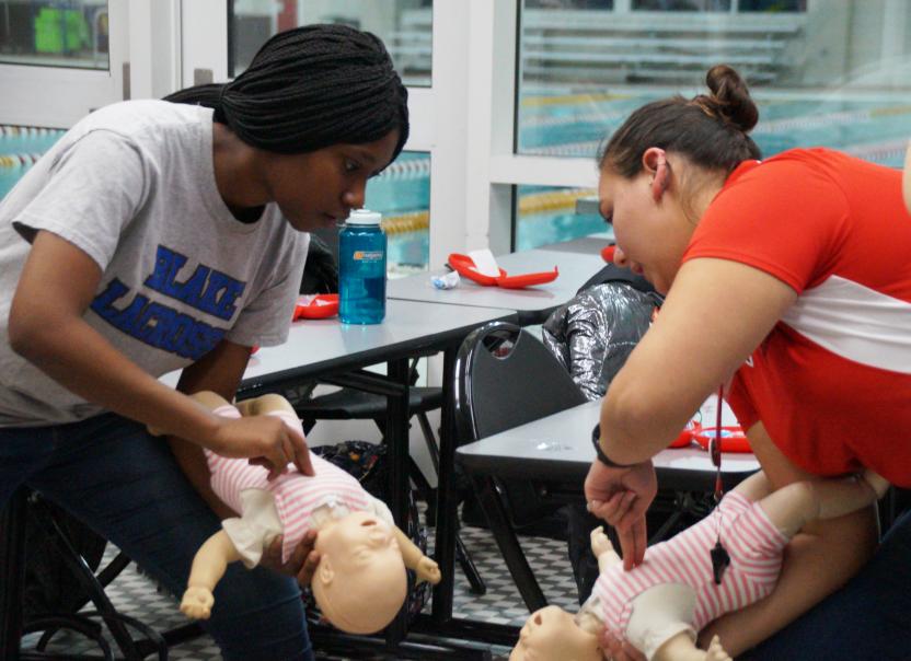woman teaching CPR
