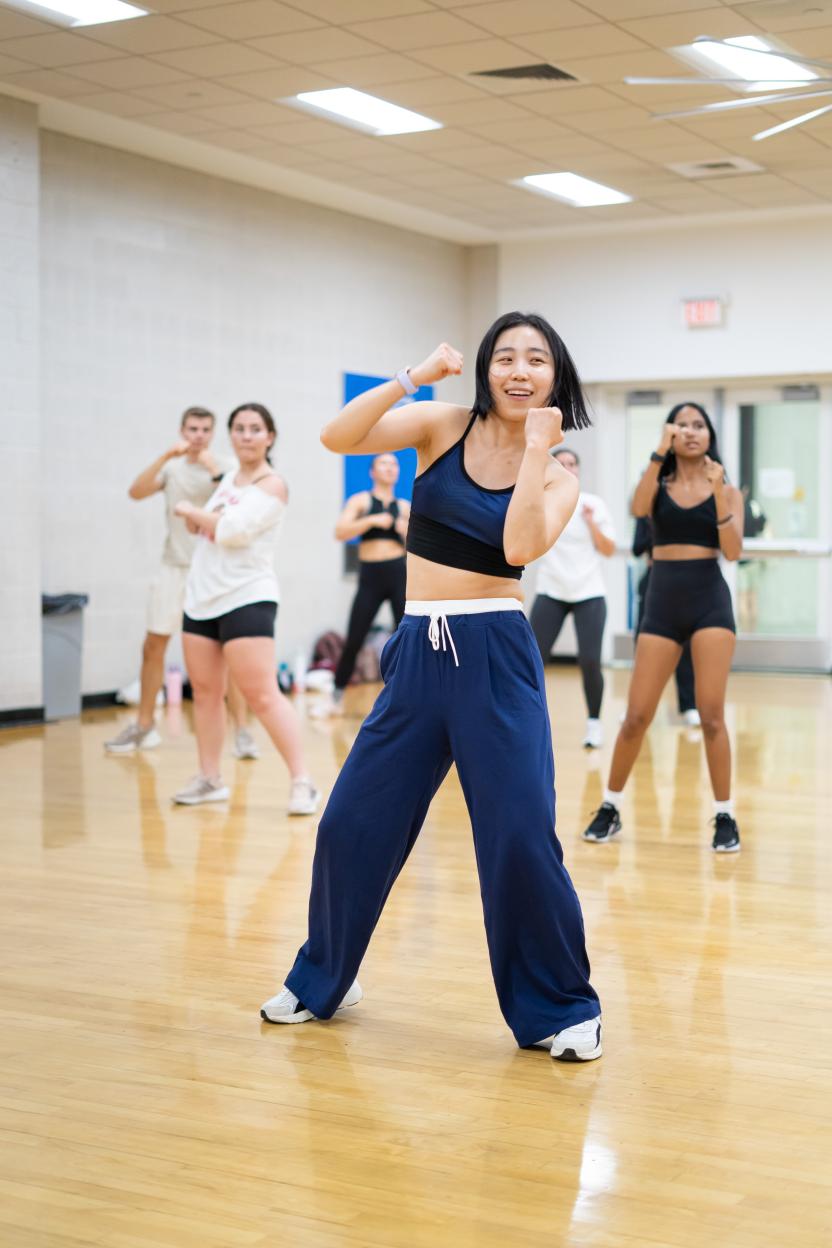woman dancing in group fitness class