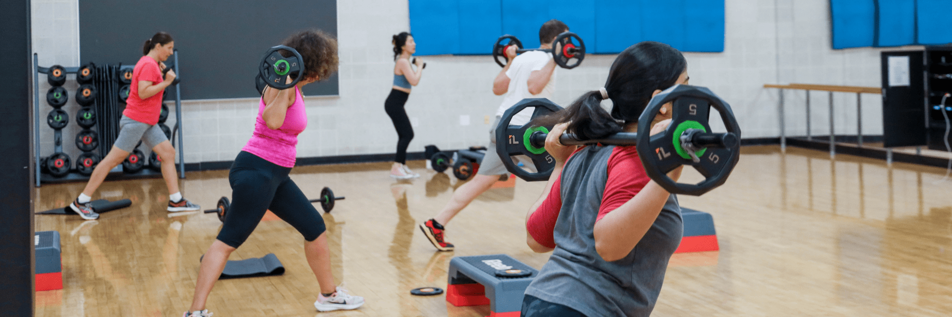 Participants in a body pump fitness class