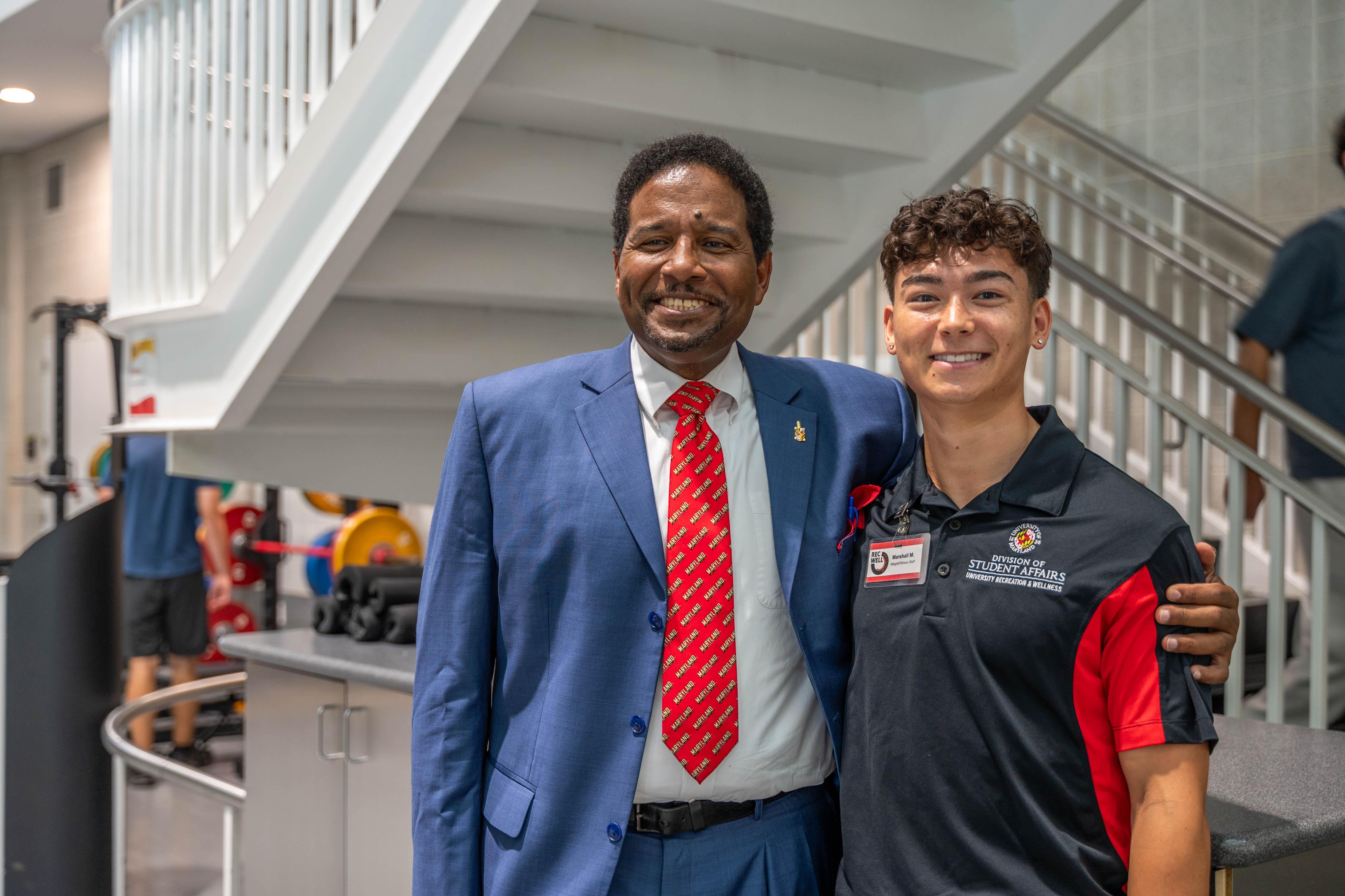 president pines with student