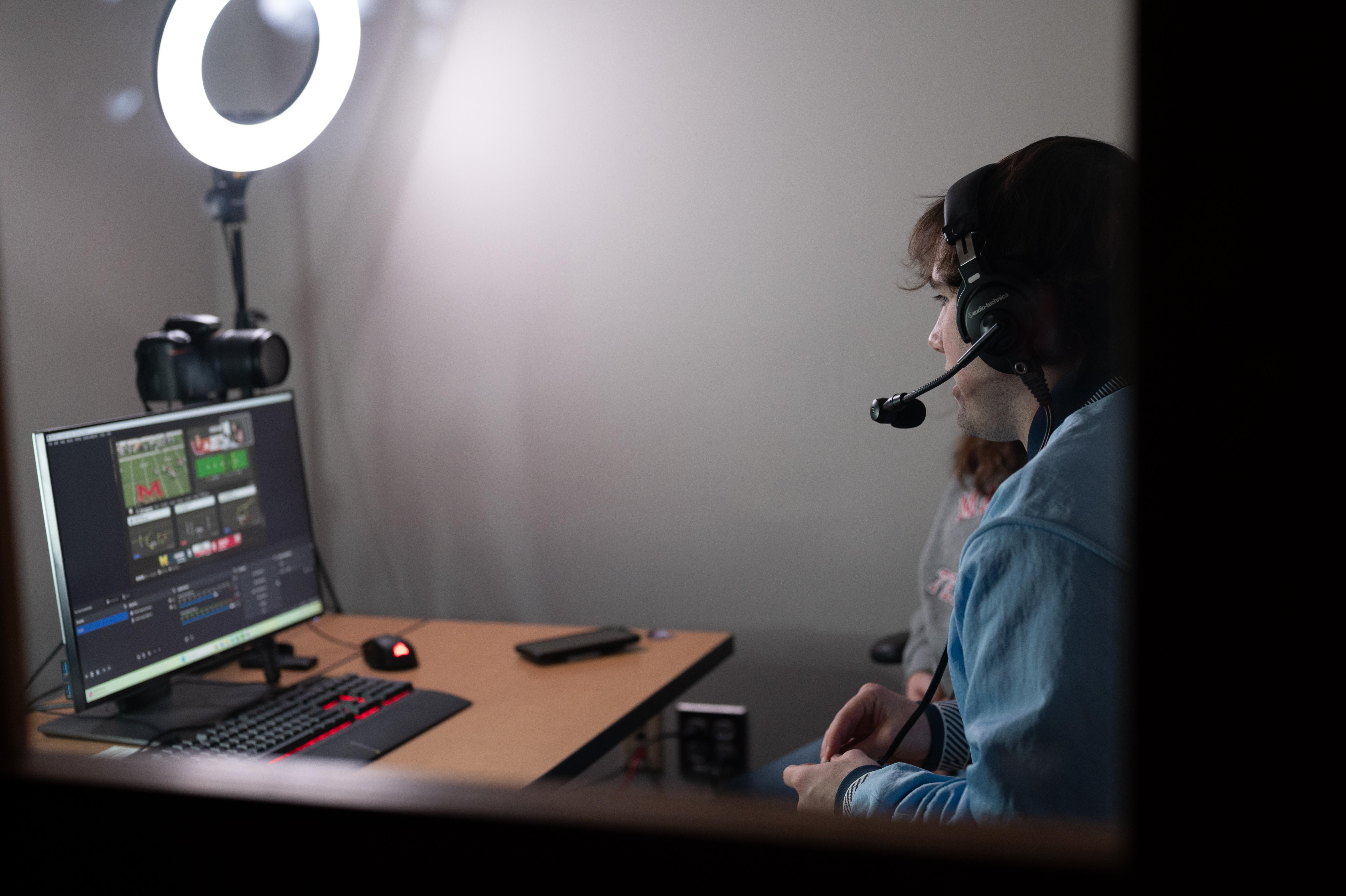 Casters in the commentary booth during a livestream.