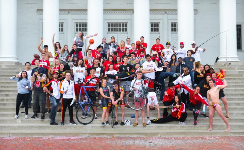group of club sport participants posing on the front steps of the Reckord Armory